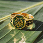 Men’s gold tiger signet ring with green enamel detail