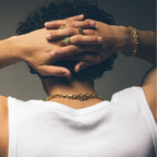 Man wearing multiple gold vermeil signet rings and chain